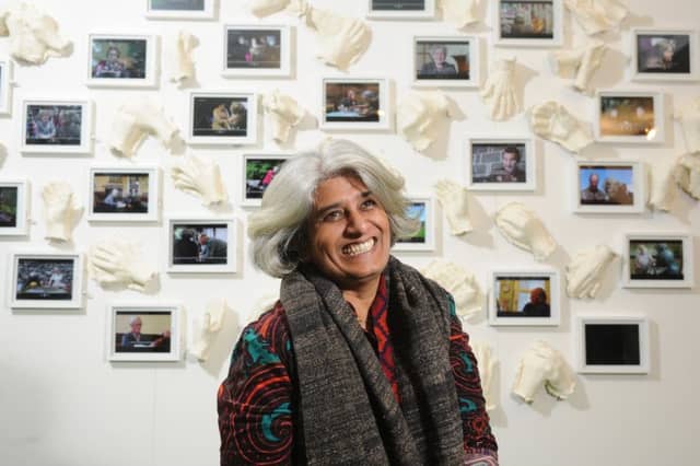 Artist Shanthamani Muddaiah with her exhibition in Settle