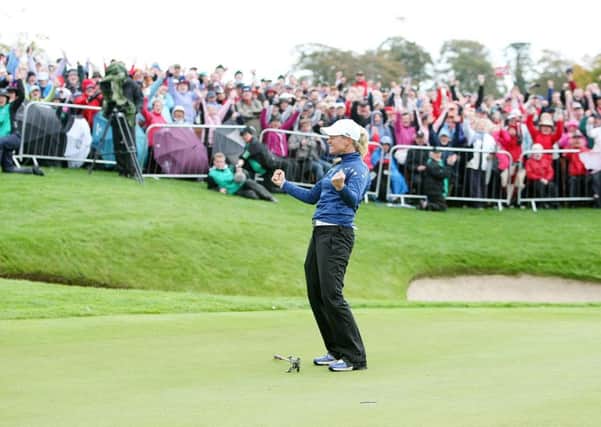 Stunning win: Europe's Suzann Pettersen celebrates after winning her singles match against USA's Michelle Wie with a putt on the 18th to clinch the Solheim Cup.