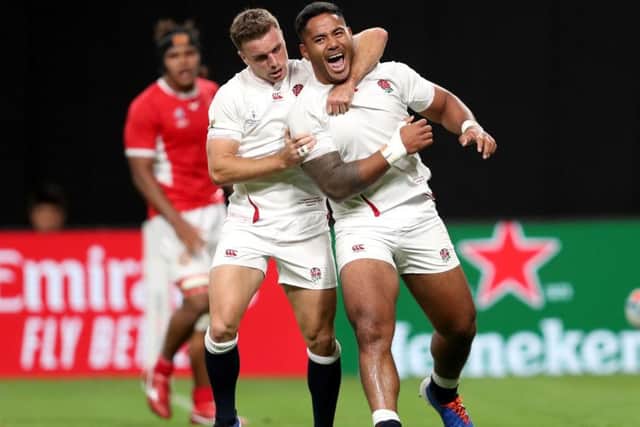 England's Manu Tuilagi (right) celebrates scoring his side's secong try with George Ford.