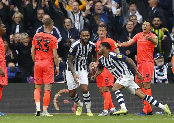 West Bromwich Albion's Darnell Furlong celebrates scoring his team's second goal against Huddersfield Town at The Hawthorns. Picture: Martin Rickett/PA