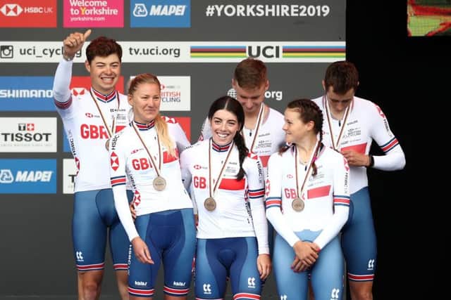 Great Britain celebrate on the podium after placing bronze in the 2019 UCI World Road Championship Team Time Trial Mixed Relay through Harrogate.