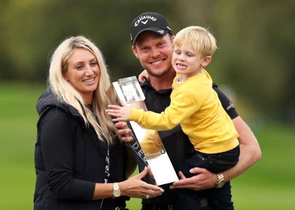 Danny Willett, his wife Nicole and son Zachariah James with the trophy after winning the BMW PGA Championship at Wentworth.