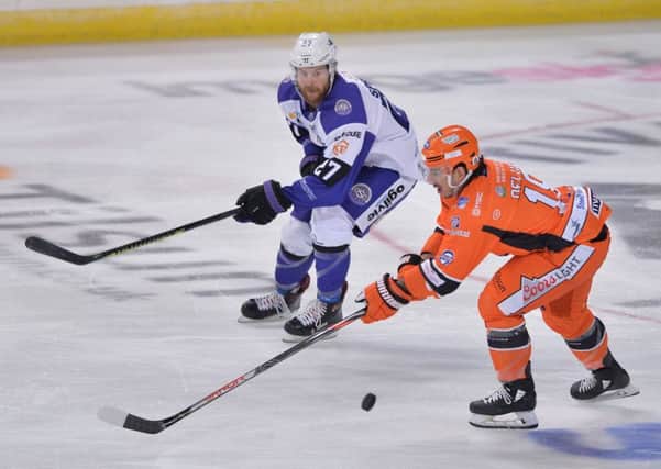 Anthony DeLuca battles for posession of the puck with Glasgow's Linden Springer. Picture: Dean Woolley.