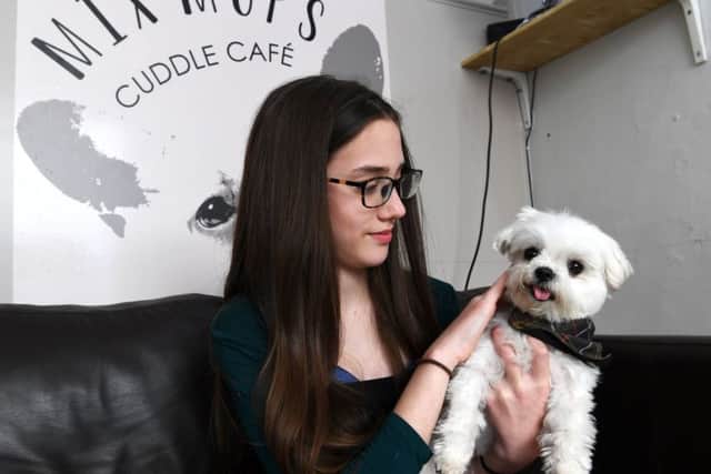 People have lots of different reasons for visiting the cuddle cafe. Ethne Pearman Little Miss Teen North Yorkshire has a cuddle. Picture Jonathan Gawthorpe