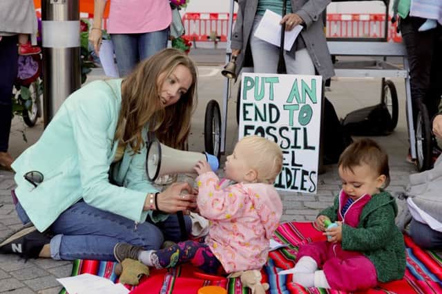 Mothers with their children in pushchairs at a protest organised by Mothers Rise Up outside Shell's UK Headquarters in London, ahead of the UN Climate Action Summit.