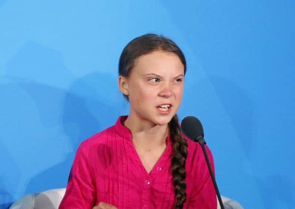 Environmental activist Greta Thunberg, of Sweden, addresses the Climate Action Summit in the United Nations General Assembly, at U.N. headquarters. (AP Photo/Jason DeCrow)