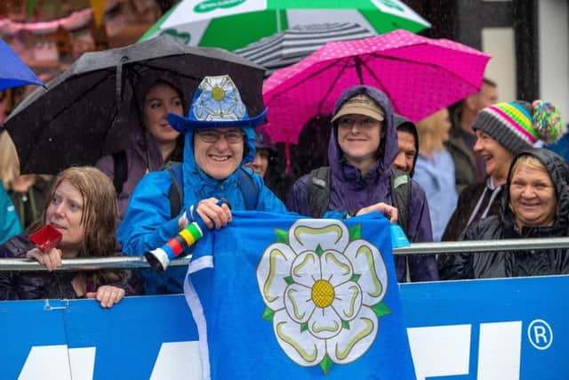 Fans in Ripon brave the horrible weather.  Picture  Bruce Rollinson