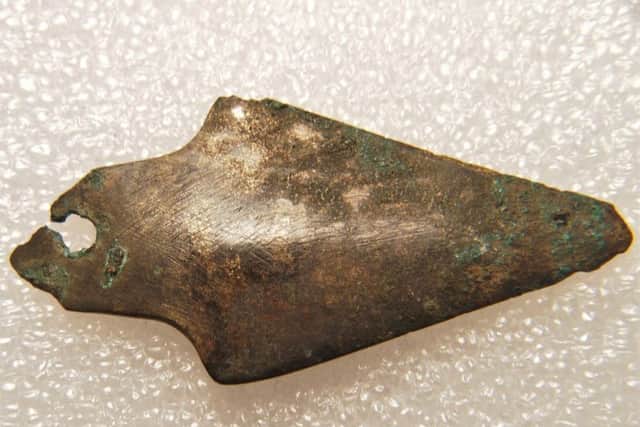 The copper or bronze knife found with the burial