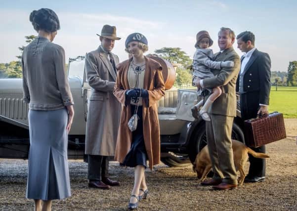 Elizabeth McGovern, from left, Harry Hadden-Paton, Laura Carmichael, Hugh Bonneville and Michael Fox, right, in a scene from Downton Abbey, the film continuation of the series that wowed audiences for six seasons, on release now (Jaap Buitendijk/Focus Features via AP)