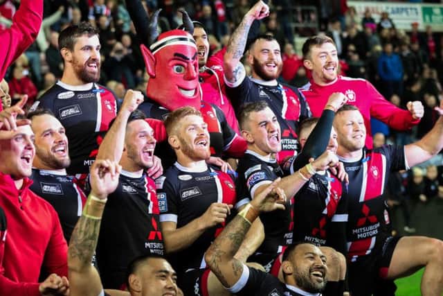 Salford Red Devils' players celebrate their win over Wigan Warriors.  Picture by Alex Whitehead/SWpix.com