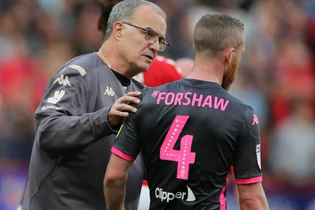 Marcelo Bielsa with Adam Forshaw after Leeds's defeat to Charlton.
