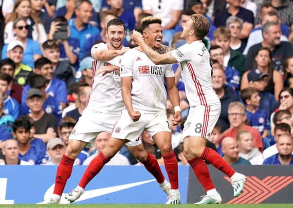 Sheffield United's Callum Robinson (centre) celebrates scoring his side's first goal of the game during the Premier League match at Stamford Bridge, London. (Picture: John Walton/PA Wire)