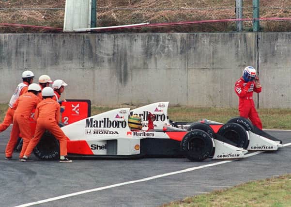 Off circuit: Ayrton Senn and bitter rival Alain Prost after their collision in Suzuka. Picture: Getty Images