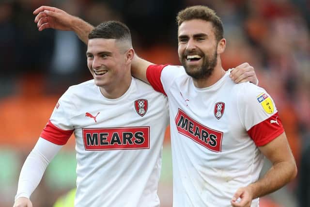Winning smiles: Rotherham United's Jake Hastie, left, and scorer Clark Robertson celebrate after the final whistle.