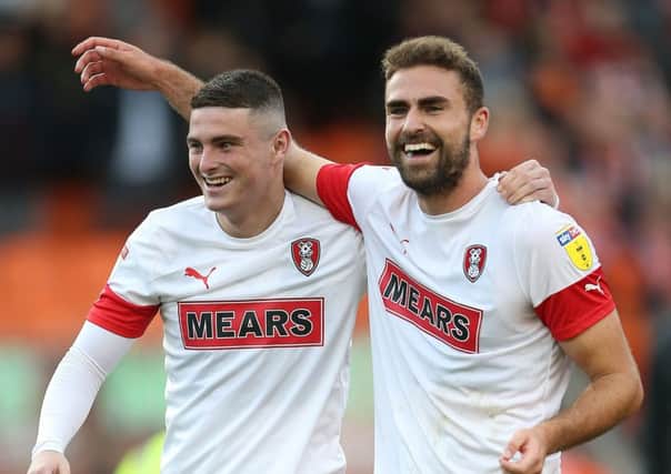 Winning smiles: Rotherham United's Jake Hastie, left, and scorer Clark Robertson celebrate after the final whistle.
