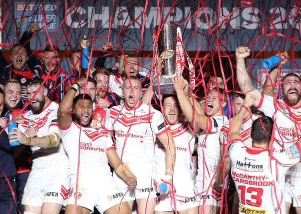 St Helens players celebrate with the trophy at Old Trafford. Picture: Martin Rickett/PA