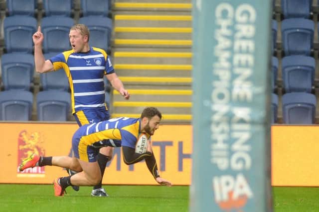 LIGHT RELIEF: Tom Bitrim dives over for a Yorkshire Canegie try, but it was not enough to trouble Bedford Blues in their opening Championship game at Headingley yesterday. Picture: Steve Riding.