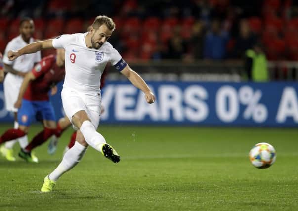 England's Harry Kane scores his side's opening goal from the penalty spot on Friday. Picture: AP/Petr David Josek