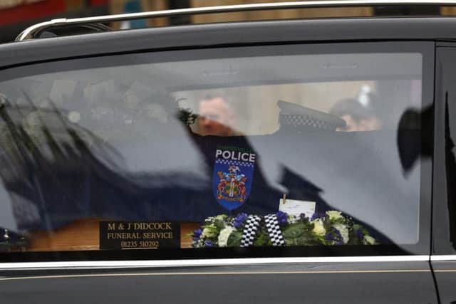 PCHarper's coffin was draped in a navy flag with a police crest on the side and was carried into the cathedral by six police officers in full uniform.
