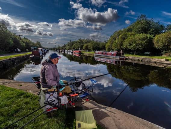Angler Richard Marper by the Aire and Calder canal at Stanley Ferry near Wakefield.