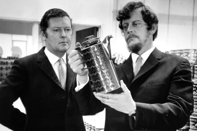 Desmond Rawson and his brother Colin Rawson (with beard) examine one of their products at Hornsea Pottery in 1970. (Yorkshire Post picture.)