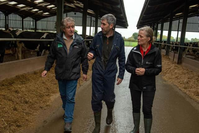 Natural England chair Tony Juniper (left) and Environment Agency chair Emma Howard Boyd (right) were shown around South Acre Farm near York by farmer Paul Tompkins (centre) who has reduced water pollution from his dairy herd with the help of the Government's Catchment Sensitive Farming service. Picture by Bruce Rollinson.