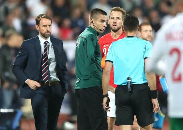 Match referee Ivan Bebek speaks to England manager Gareth Southgate (left) and Harry Kane (centre right). Picture: Nick Potts/PA