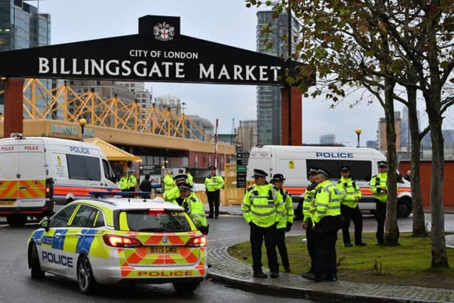 Police at Billingsgate Market in London on the day Animal Rebellion tried to target producers and suppliers of meat and fish.