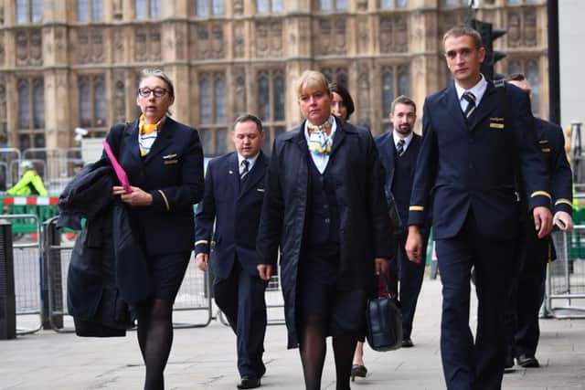 Former Thomas Cook employees arrive at Portcullis House in Westminster for the Business, Energy and Industrial Strategy Committee inquiry into the collapse of the British travel operator. Photo: Victoria Jones/PA Wire
