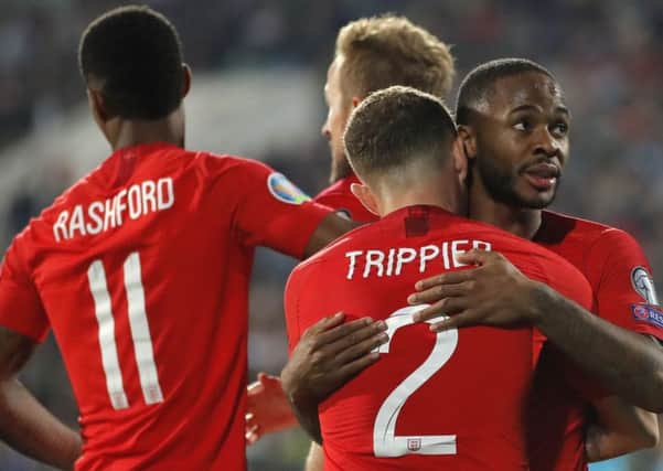 England's Raheem Sterling, right, celebrates after scoring his side's fourth goal during the Euro 2020 group A qualifying soccer match between Bulgaria and England, at the Vasil Levski national stadium, in Sofia (AP Photo/Vadim Ghirda)