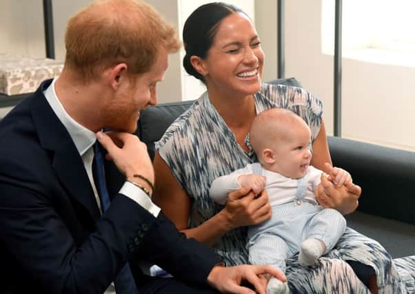 The Duke and Duchess of Sussex holding their son Archie during a meeting with Archbishop Desmond Tutu and Mrs Tutu at their legacy foundation in cape Town, on day three of their recent tour of Africa.