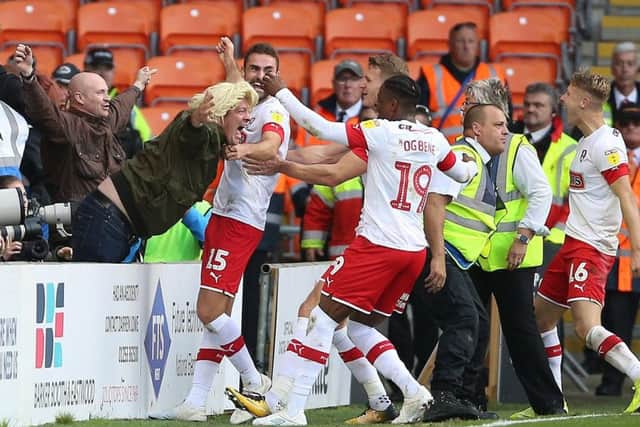 Rotherham United's Clark Robertson (No15 centre) celebrates scoring at Blackpool.