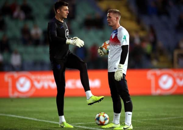 In safe hands: England goalkeepers Nick Pope and Sheffield United's Dean Henderson warm up prior to the UEFA Euro 2020 qualifying match at the Vasil Levski National Stadium, Sofia, Bulgaria.