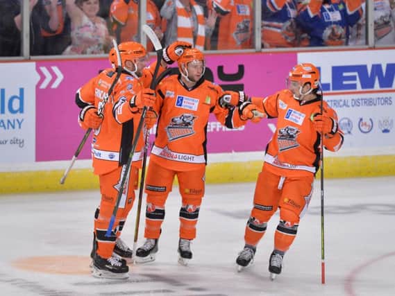 Michael Davies, second right, celebrates his fifth-minute power play opener for the Steelers against Fife. Picture: Dean Woolley.