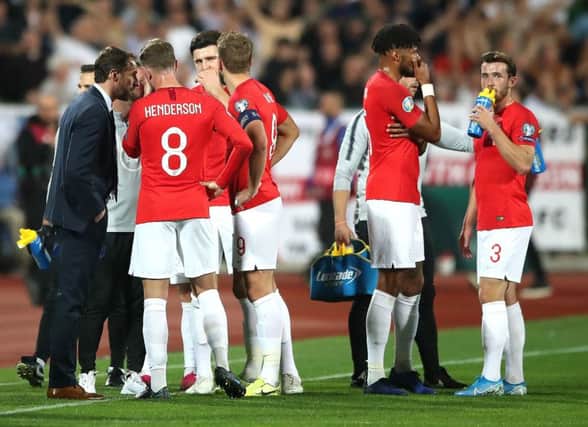 England manager Gareth Southgate (left) speaks to the players with regards to racist chanting from fans during the UEFA Euro 2020 Qualifying match at the Vasil Levski National Stadium, Sofia, Bulgaria.