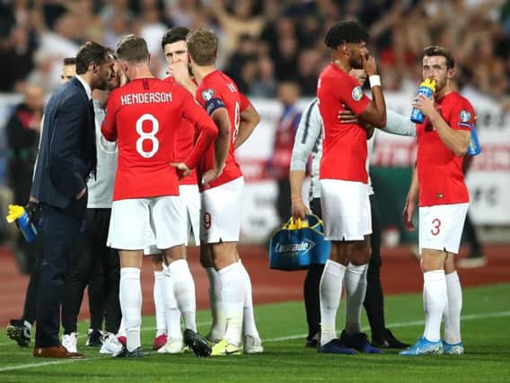 Gareth Southgate (left) speaks to players with regards to racist chanting from fans during the UEFA Euro 2020 Qualifying match at the Vasil Levski National Stadium, in Sofia, this week.