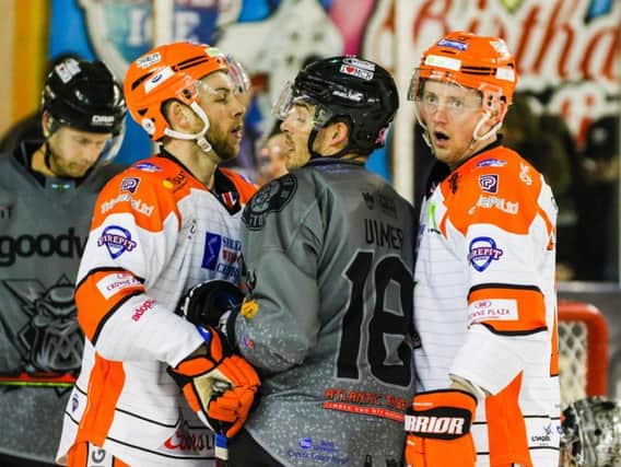 TOUGH NIGHT: Sheffield Steelers' Ben O'Connor and Davey Phillips get up close and personal with Manchester's Layne Ulmer. Picture: Mark Ferriss.