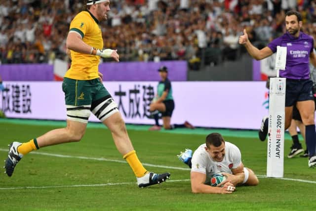 England's Jonny May scores his sides first try at Oita Stadium. Picture: Ashley Western/PA