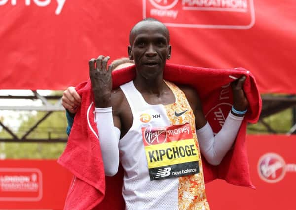 Kenya's Eliud Kipchoge: Was helped to break barrier.