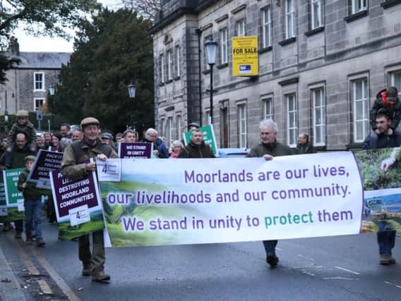 Demonstrators from the Yorkshire Moorland Communities braved the weather to take a message to BBC Presenter Chris Packham as he arrived at the Royal Hall in Harrogate.