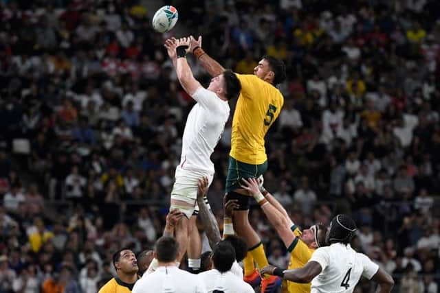 England's Tom Curry jumps for the ball at a lineout