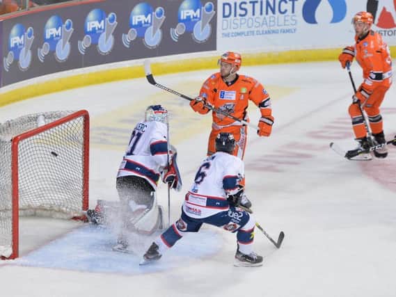 SWAT TEAM: Robert Dowd watches as his attempt goes over the line to give Sheffield Steelers a 2-0 lead against Dundee Stars on Sunday night. Picture: Dean Woolley.