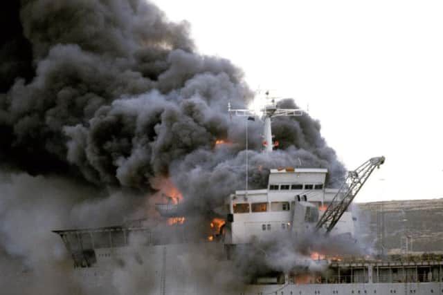File photo dated 08/06/82 of the Landing Ship Logistic RFA Sir Galahad ablaze after the Argentine air raid on June 8th at Bluff Cove near Fitzroy settlement on East Falkland. PRESS ASSOCIATION Photo: Martin Cleaver/PA Wire