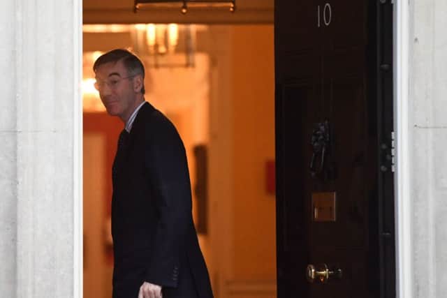 Commons leader Jacob Rees-Mogg arrives at 10 Downing Street.