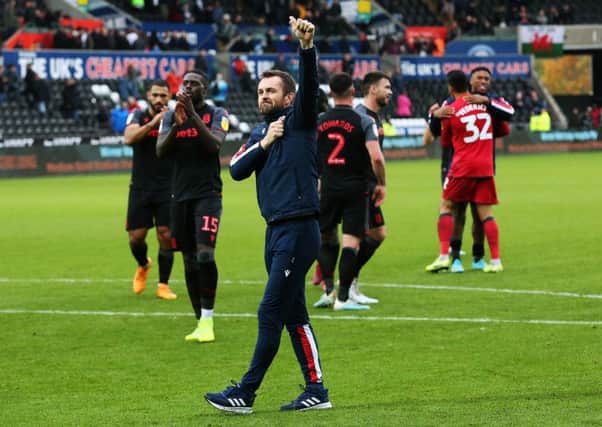 Stoke City manager Nathan Jones pumps his chest towards the Stoke City fans. Picture: Mark Kerton/PA