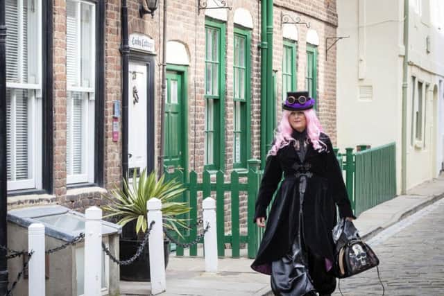 A goth woman on Whitby's historic streets