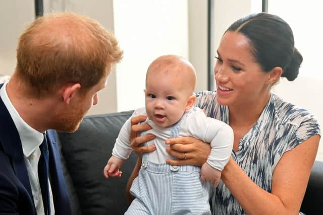 Prince Harry and his wife Meghan, Duchess of Sussex, holding their son Archie in Cape Town, South Africa.Picture: Dominic Lipinski/PA Wire