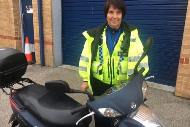 PCSO Liz Smith with her scooter.