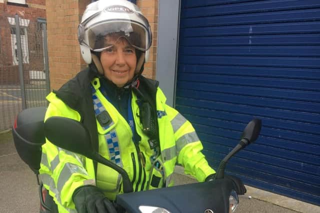 PCSO Liz Smith with her scooter.