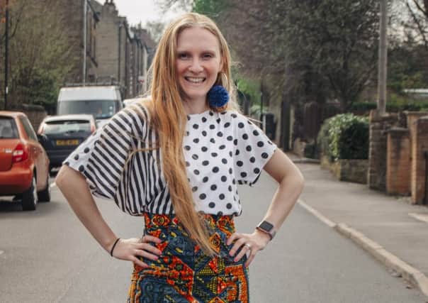 Founder of My Indie Wardrobe Hannah Clugston in Sheffield street wearing a vintage polka dot t-shirt, socks by Cutesy Huge, handmade pom-pom earrings and a skirt by El-Addo. Image by Madeleine Winters.